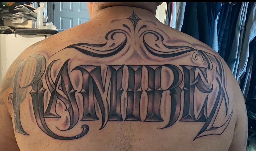 Chicano lettering lettering tattoo on the back by Mi♥️Amor♥️Ink