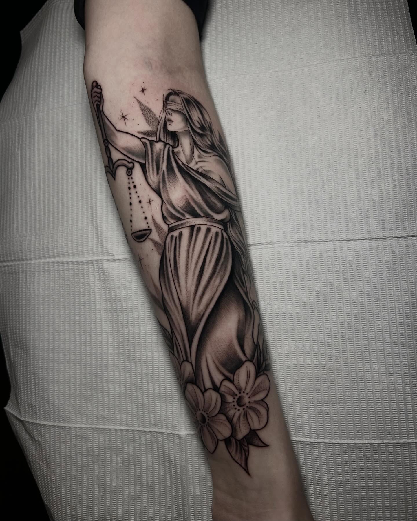 Lady Justice realism tattoo on the forearm by Heaven Arianna