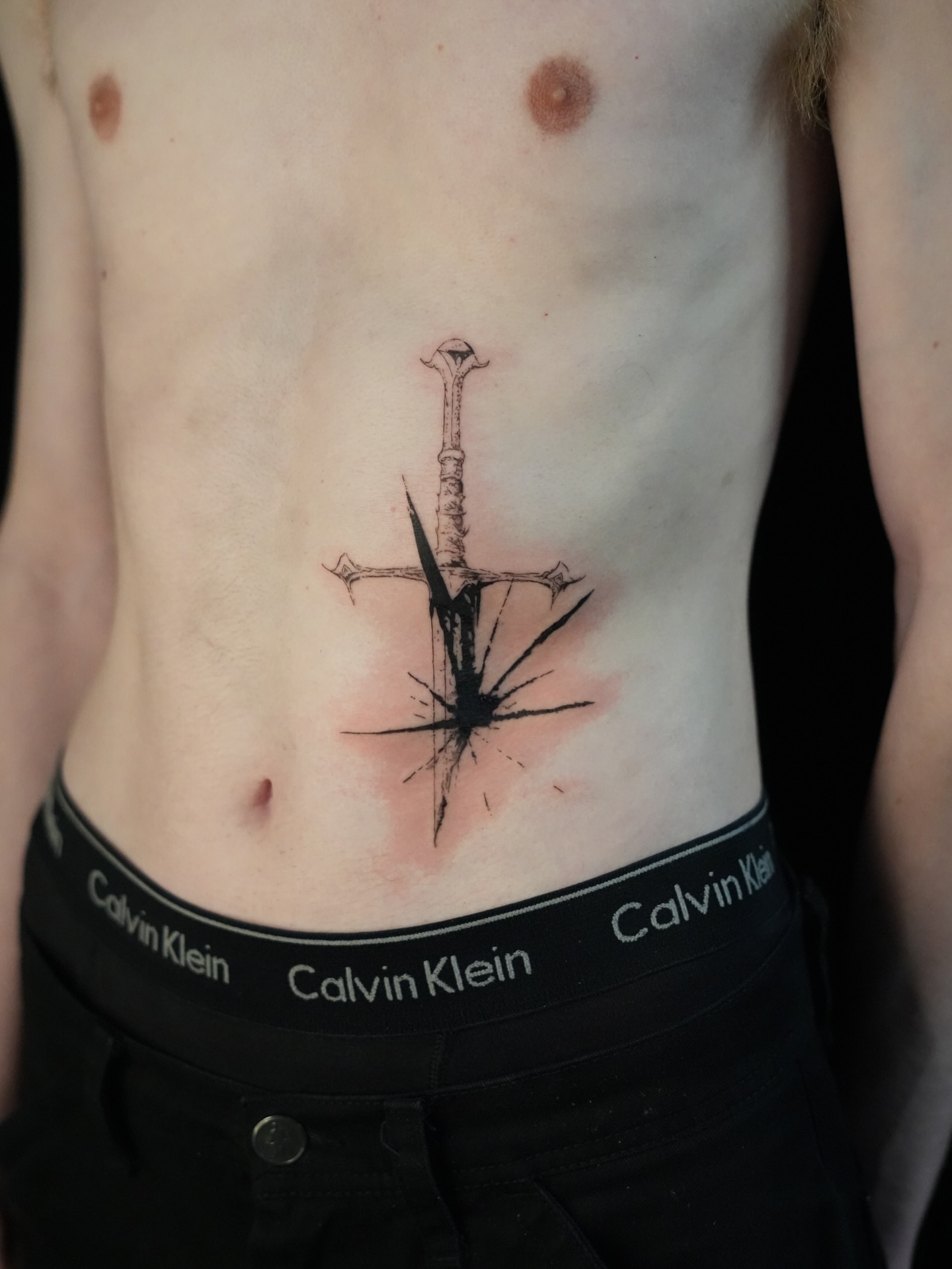 Sword black and grey tattoo on the ribs by alyssa ⋆₊ ♱