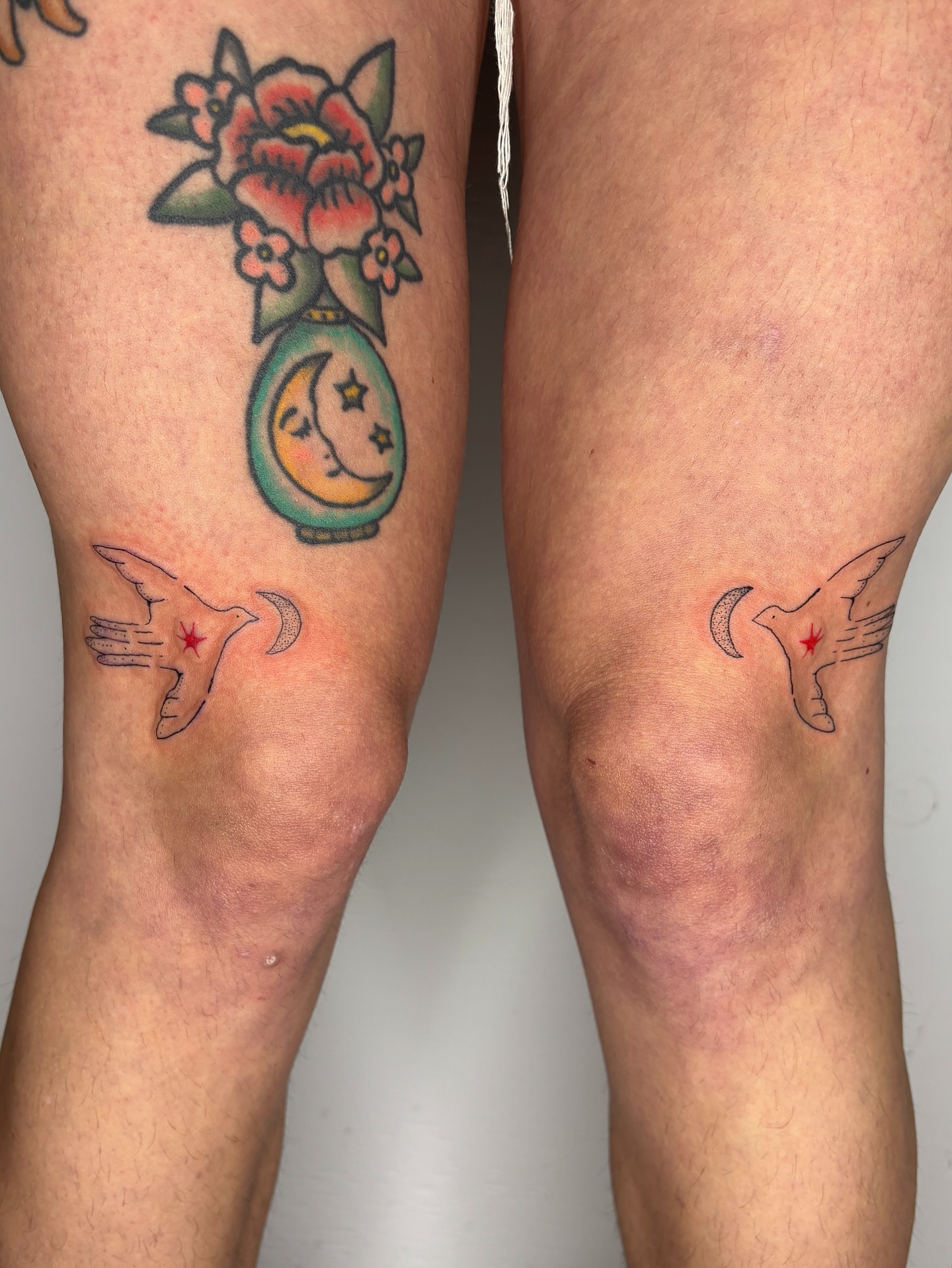 Flower vase with moon and stars American traditional tattoo on the thigh by Raye