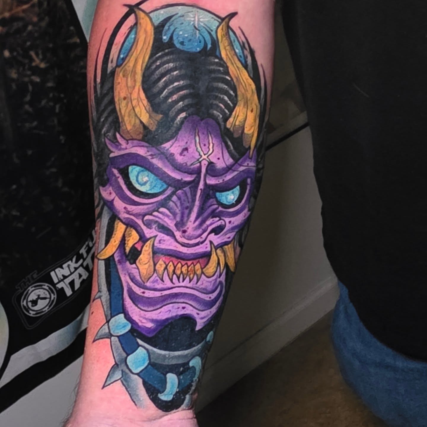 Demon mask American traditional tattoo on the forearm by BZ Artistry