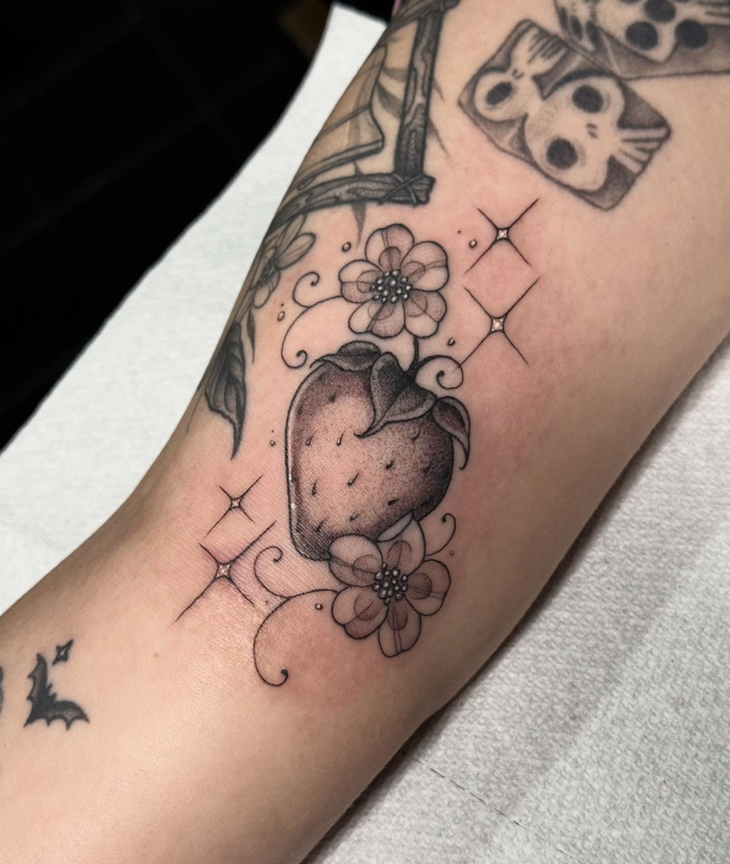 Strawberry and flowers black and grey tattoo on the forearm by ☠︎ Mikayla Benson  ☠︎