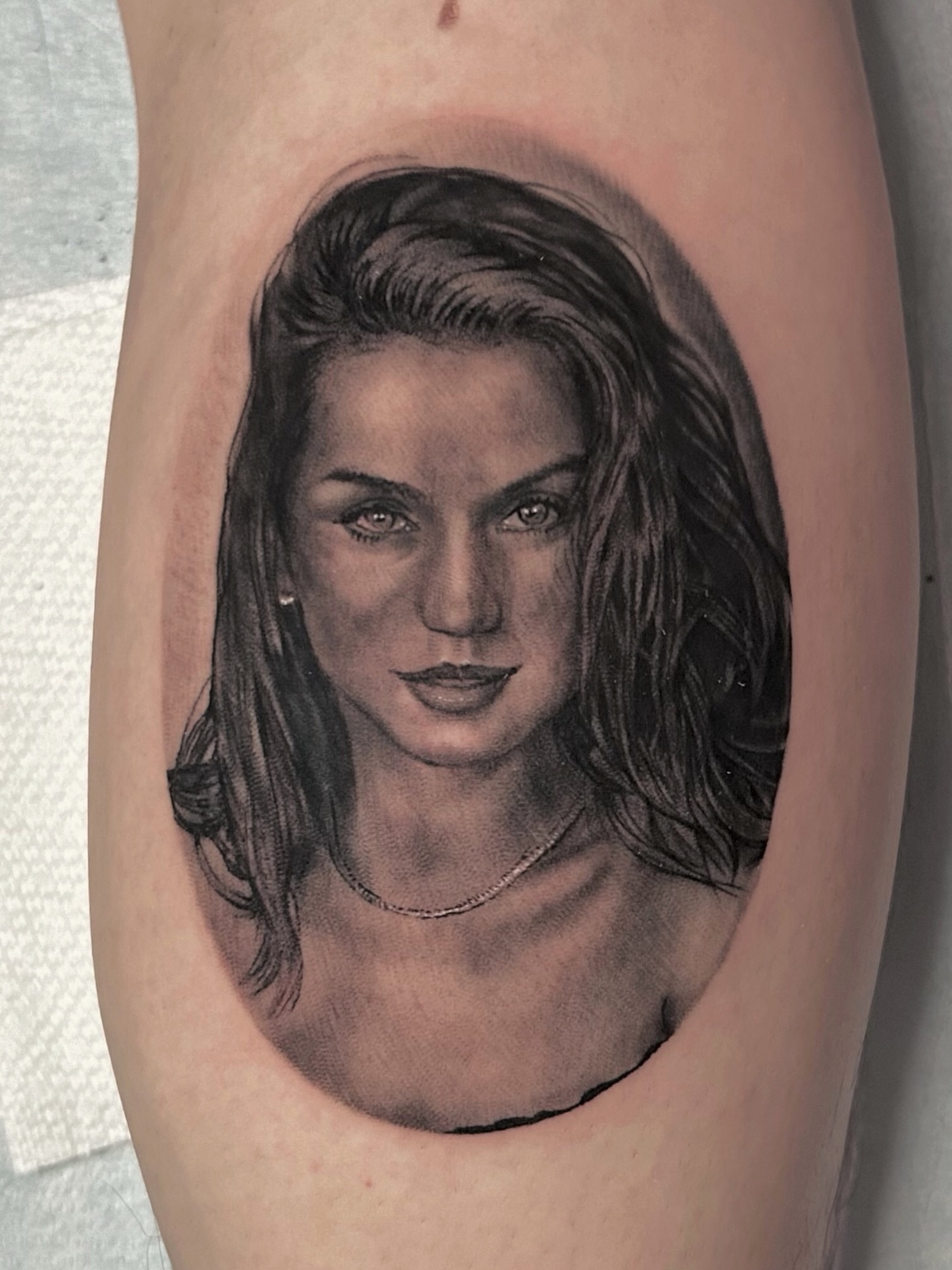 Portrait realism tattoo on the forearm by Justin James