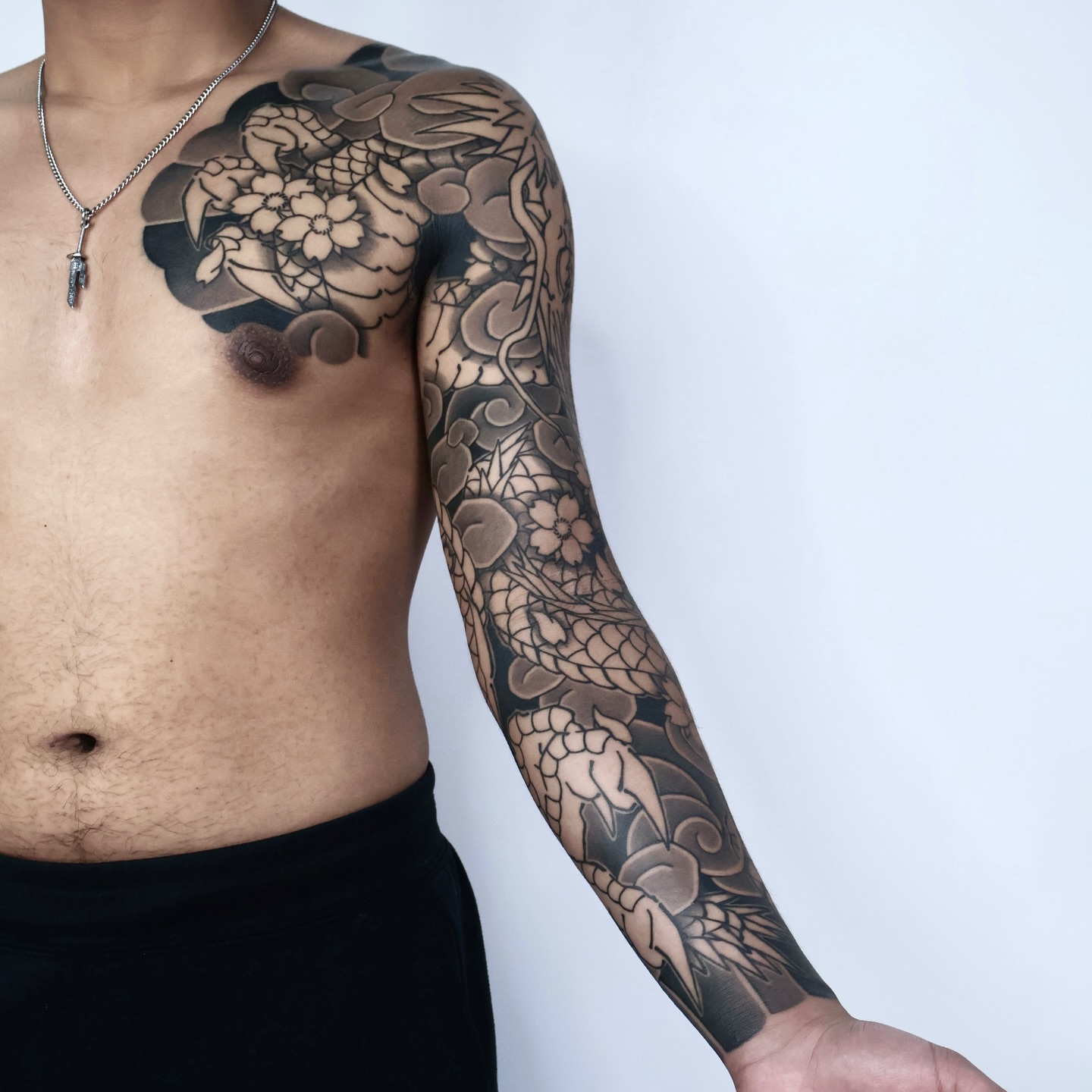 Floral and vine black and grey tattoo on the upper arm by JM kim, Melbourne, Victoria