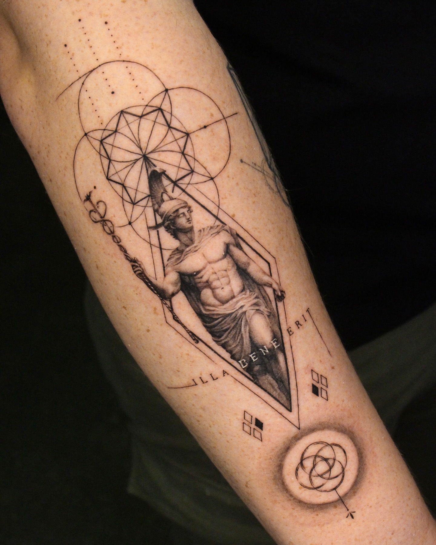 Statue with geometric patterns geometric tattoo on the forearm by Tattoo artist EJ (Mireu)