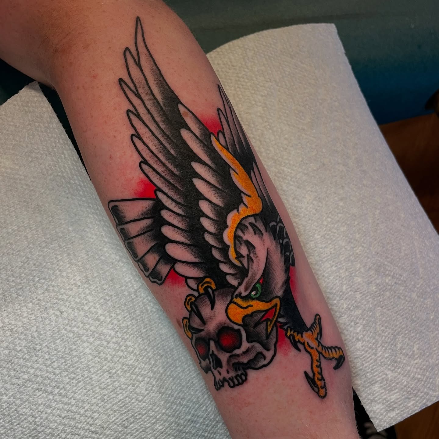 Eagle and skull American traditional tattoo on the forearm by Ian Spong