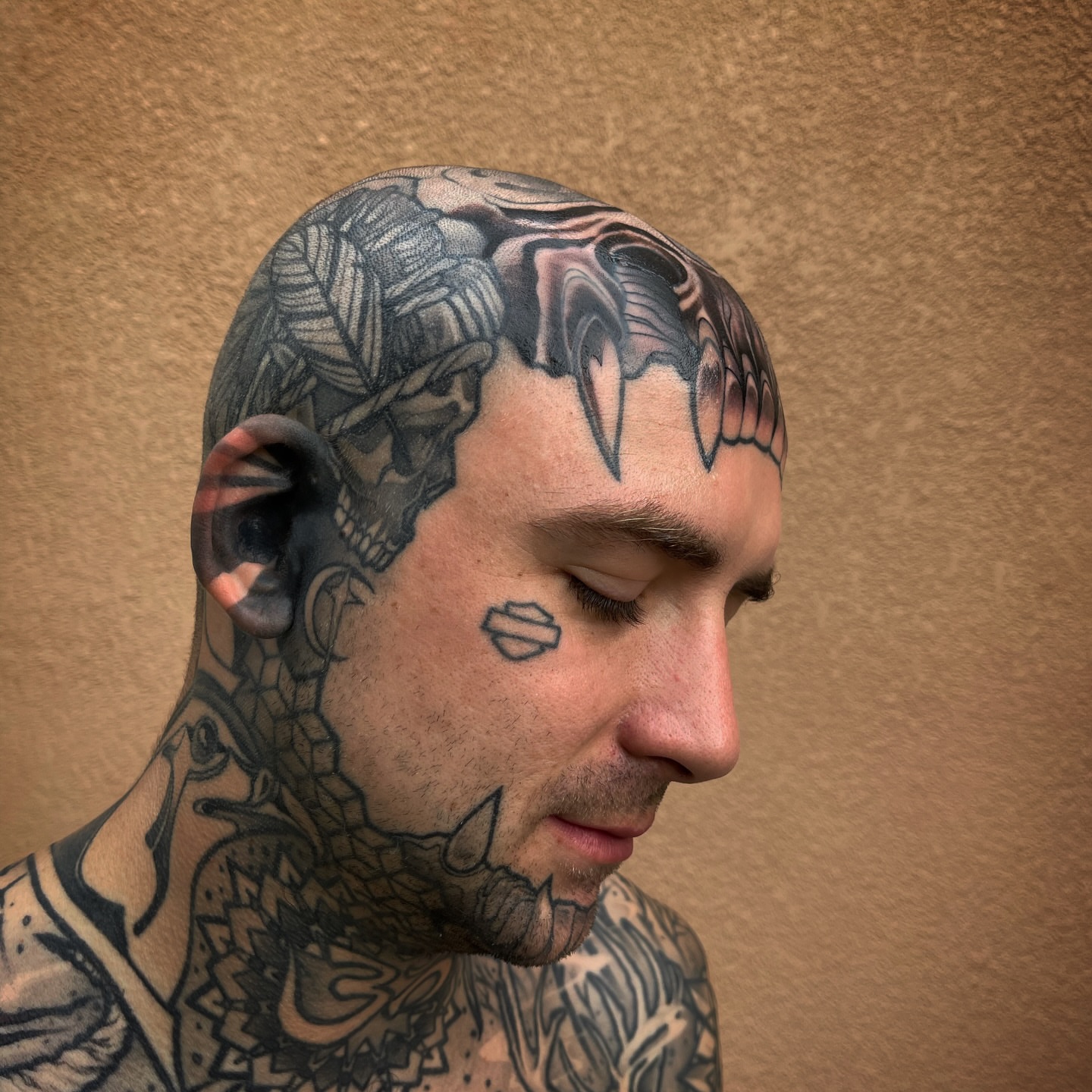 Skull black and grey tattoo on the head by Ryan K Severe