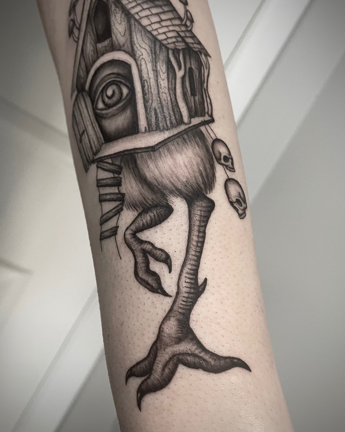 House with eyes realism tattoo on the forearm by @tatts_by_kat