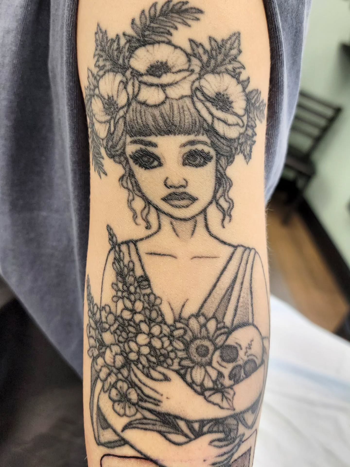 Woman with flowers realism tattoo on the forearm by Chantel Chan, Portland, Oregon