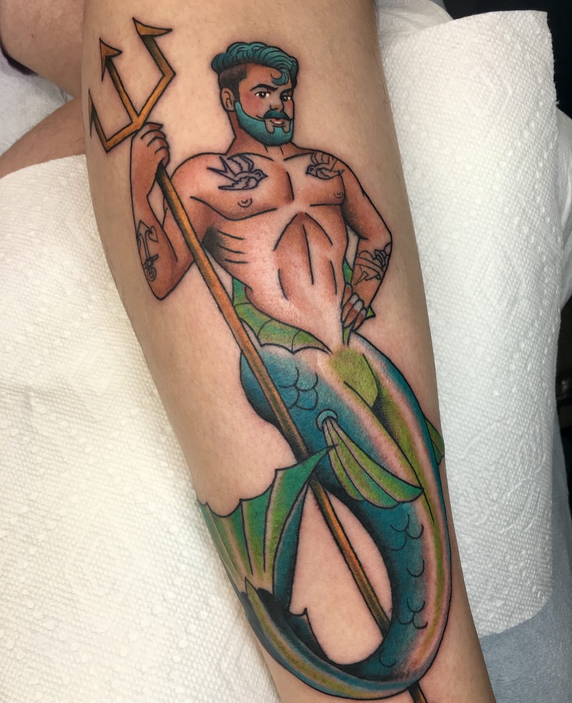 Mercury American traditional tattoo on the forearm by Stacey Martin Smith