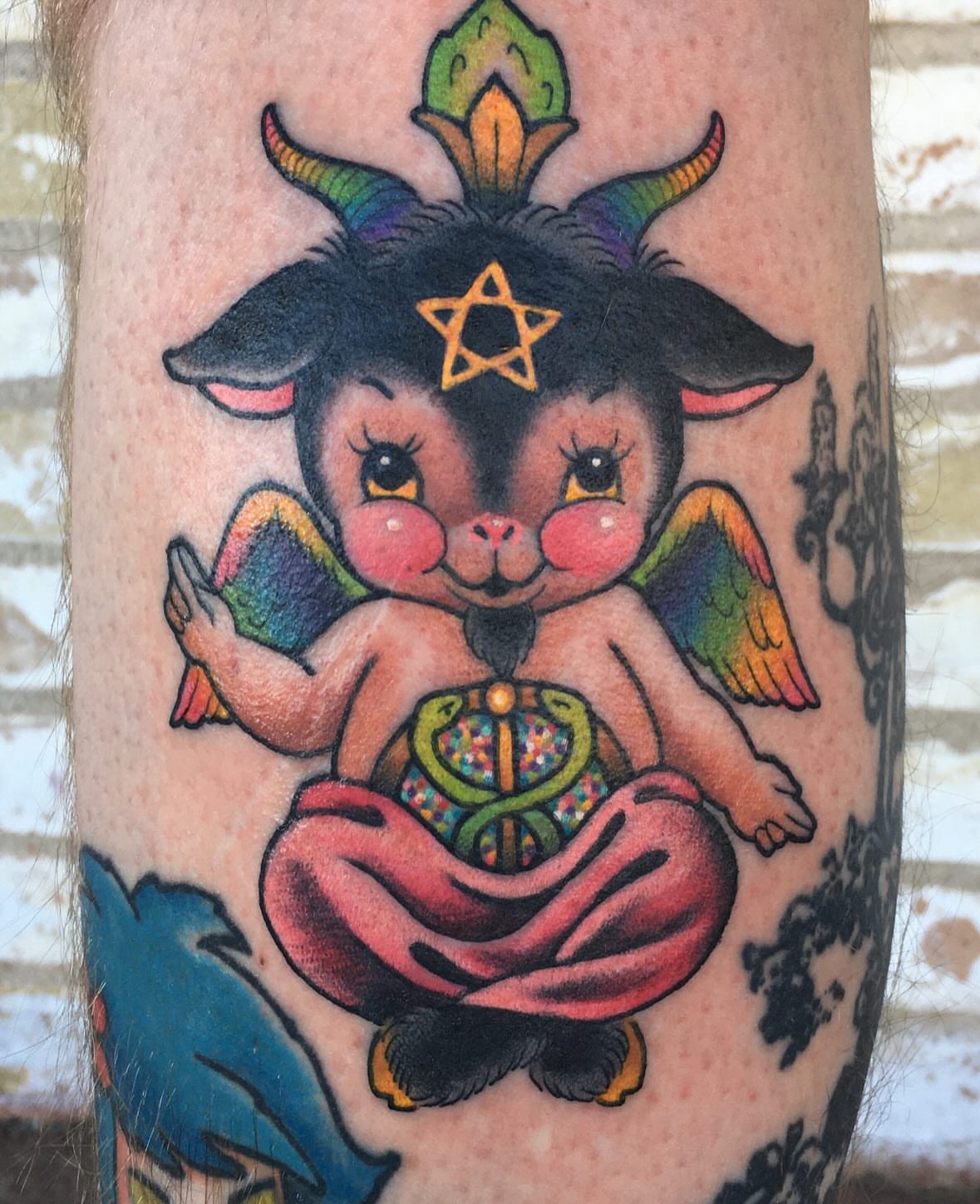 Goat-like creature new school tattoo on the forearm by Stacey Martin Smith