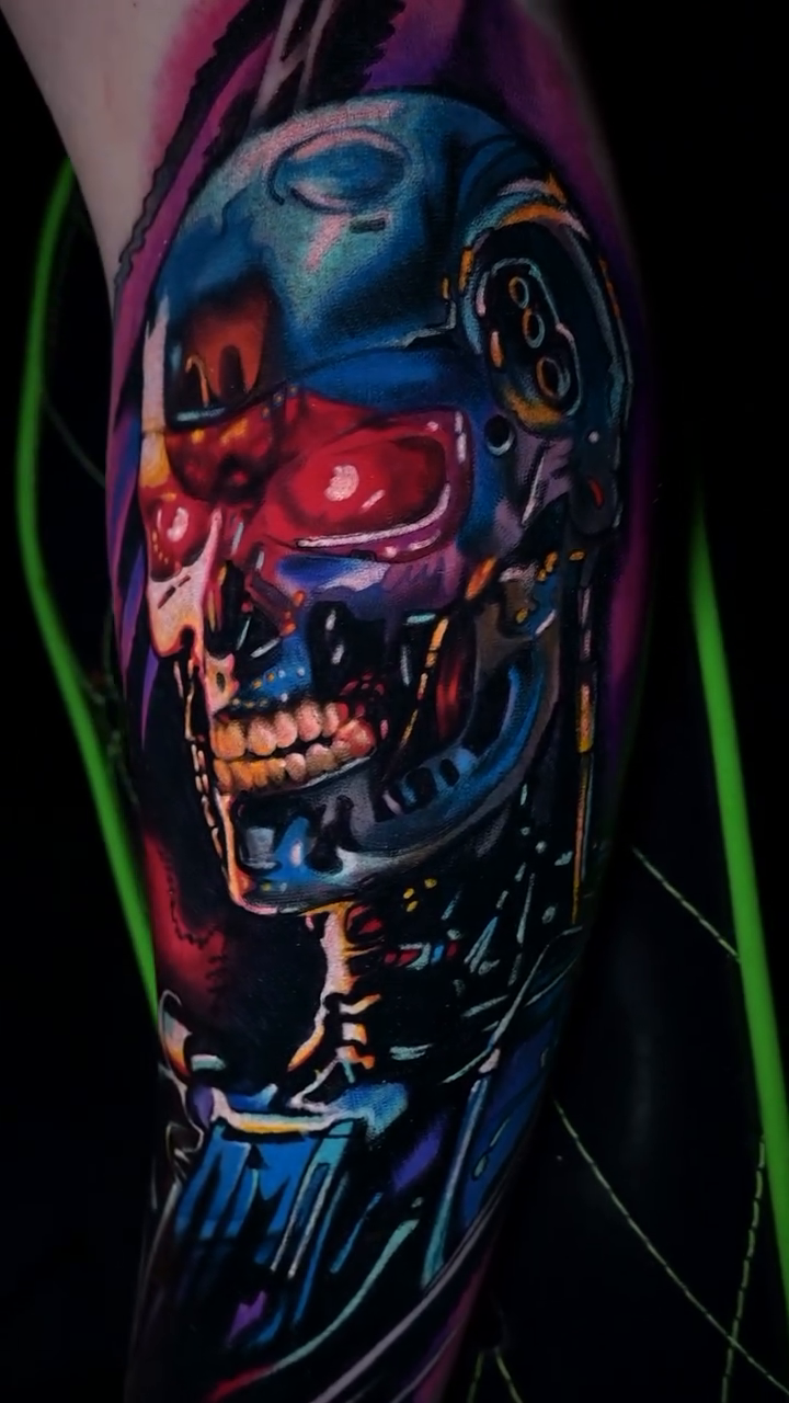 Terminator skull surrealism tattoo on the forearm by William Pollock