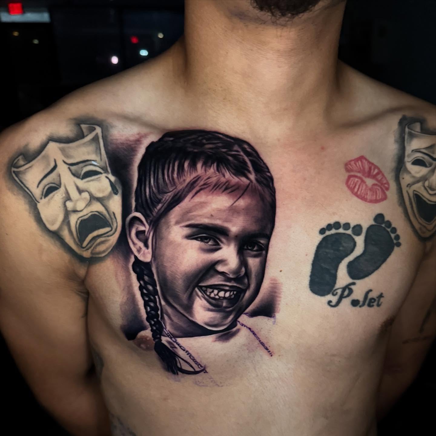 Child's face realism tattoo on the chest by Drink Ink Tattoos™ 👽