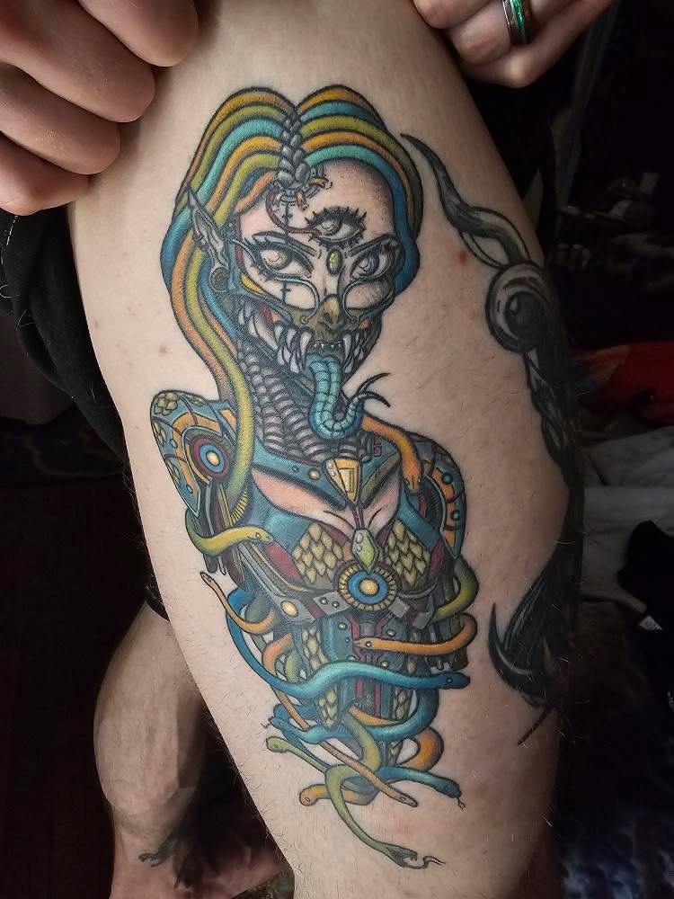 Snake and woman geometric tattoo on the thigh by Chloe Peters 🦭🦄🏳️‍🌈