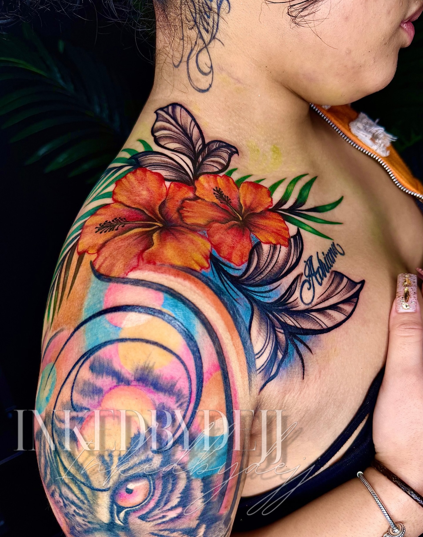 Tiger and hibiscus watercolor tattoo on the shoulder by Inkedbydejj