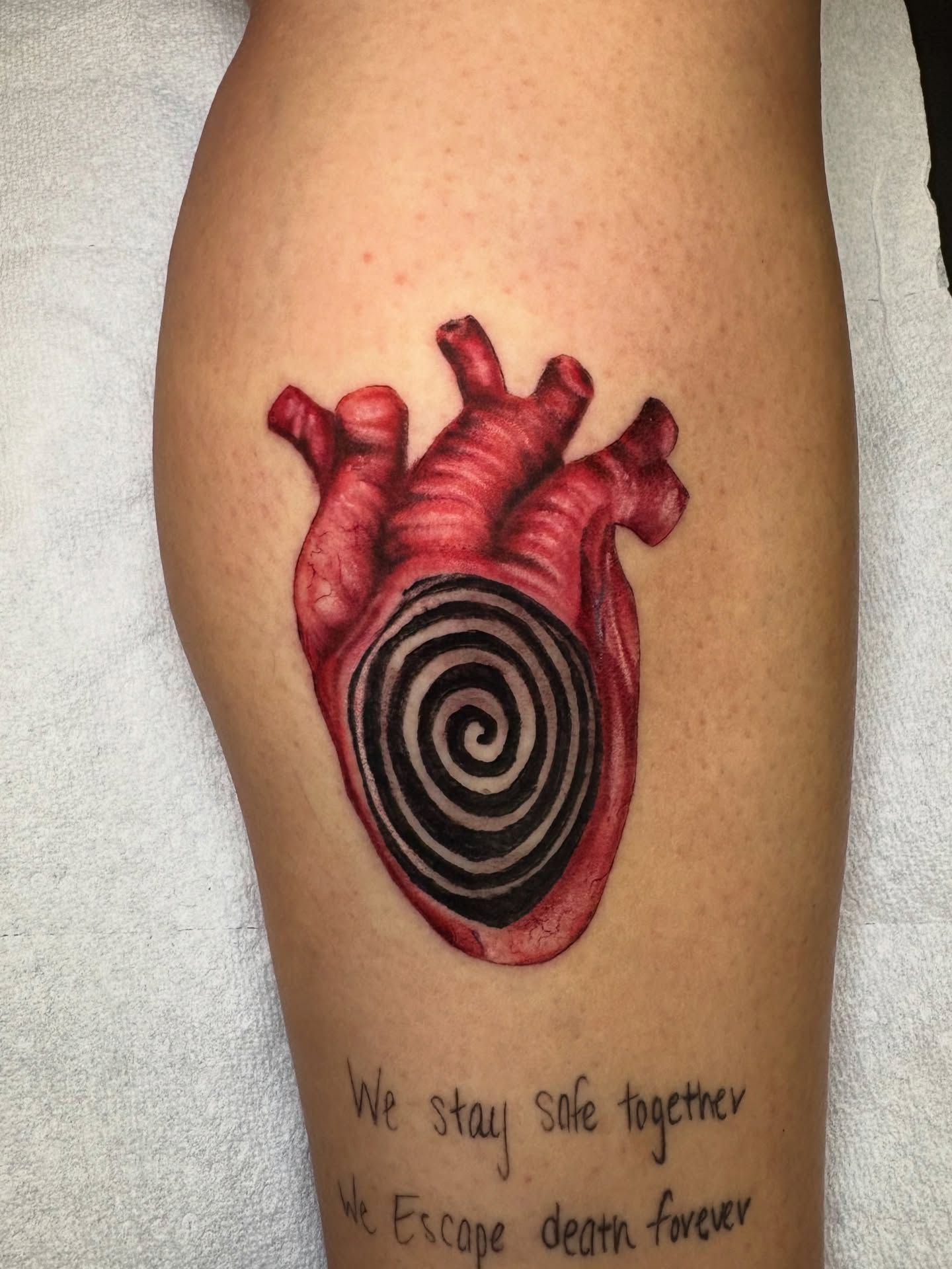Heart with spiral realism tattoo on the thigh by Flor, Dallas, Texas