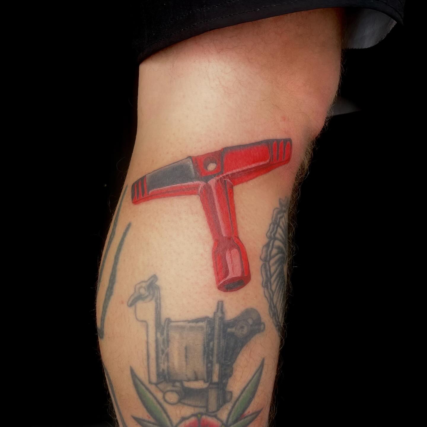 Red tool American traditional tattoo on the forearm by Chase Healey, Salt Lake City, Utah