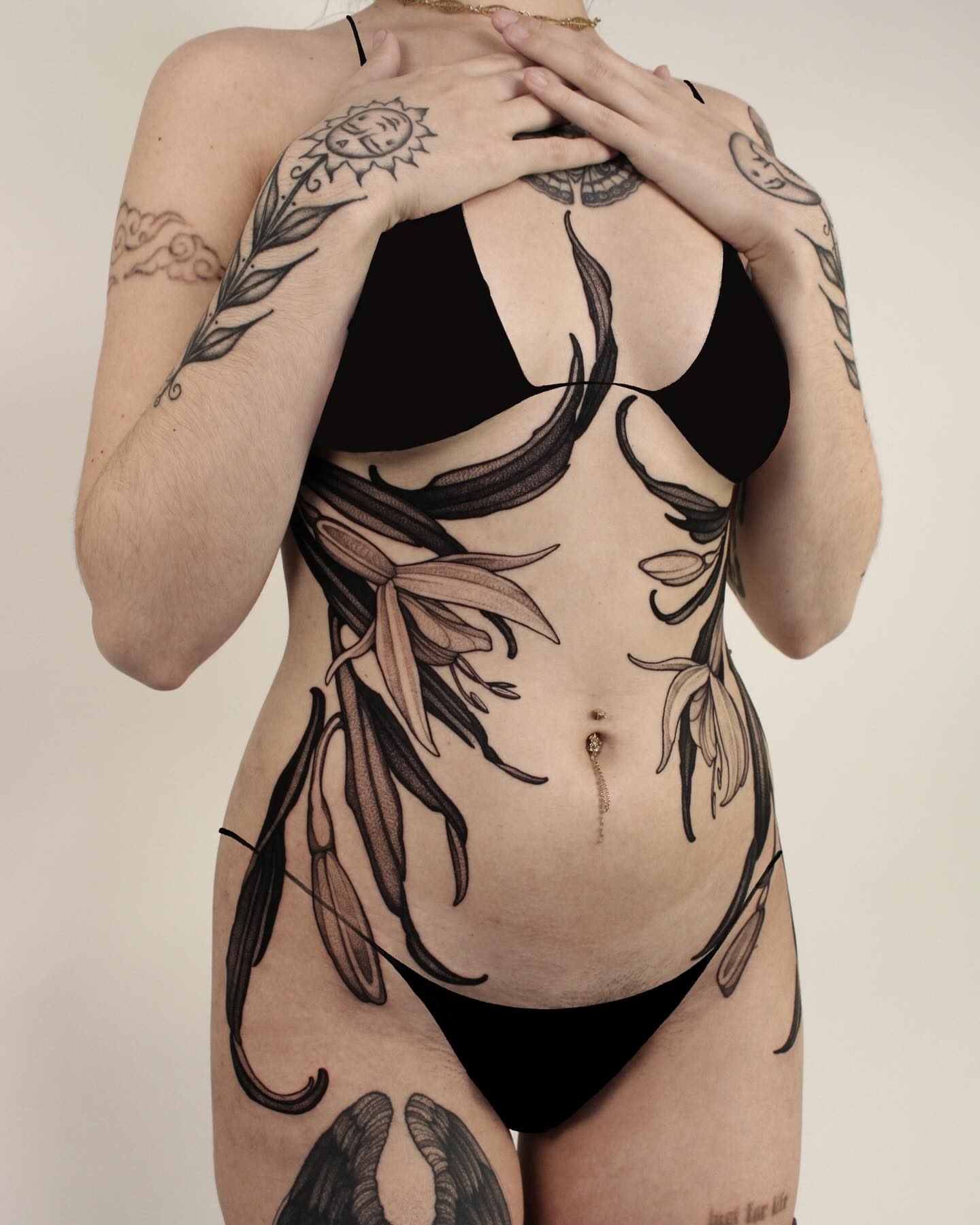 Floral black and grey tattoo on the torso by Heather Apgar