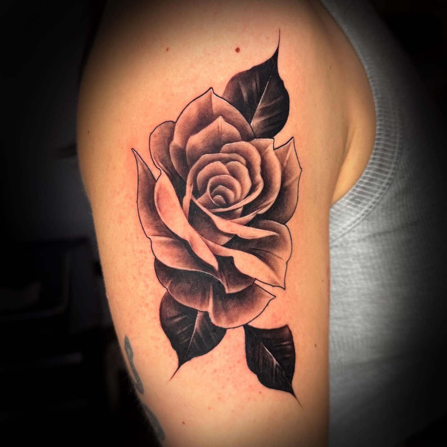 Rose black and grey tattoo on the shoulder by Keith (KAM) Miller