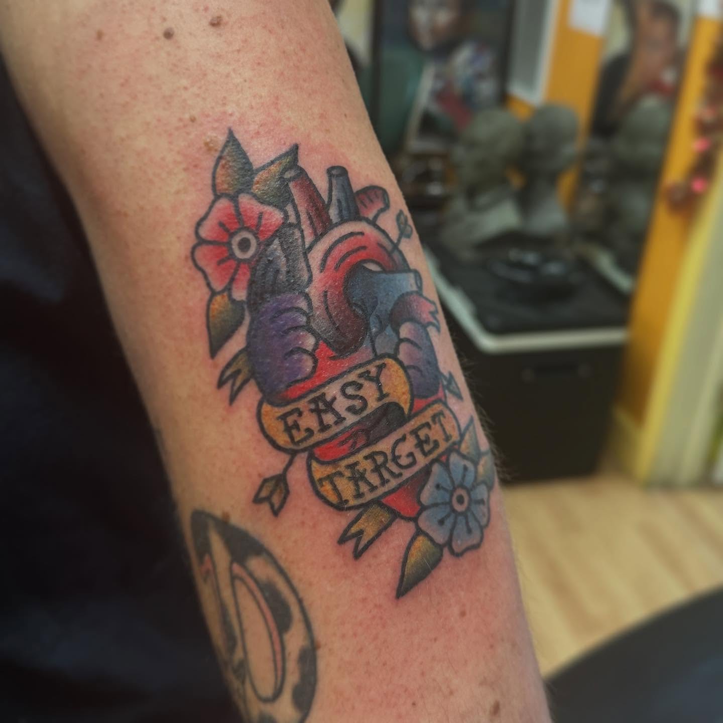 Heart with arrow American traditional tattoo on the forearm by norawillstattoo