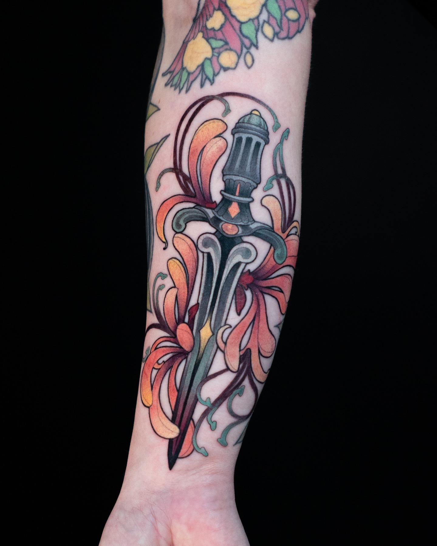 Sword and flowers American traditional tattoo on the forearm by Hannah Steele