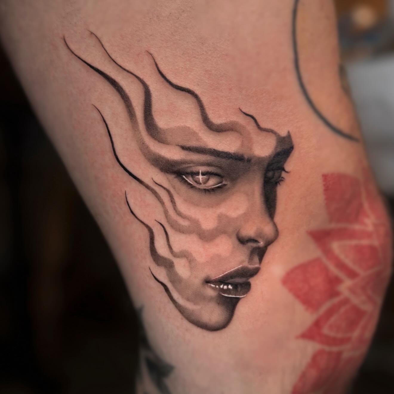 Flame and woman's face realism tattoo on the forearm by Jas Knight