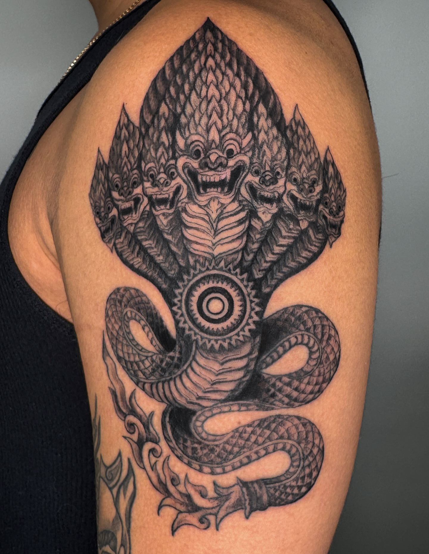 Multi-headed snake geometric tattoo on the shoulder by Tiffany