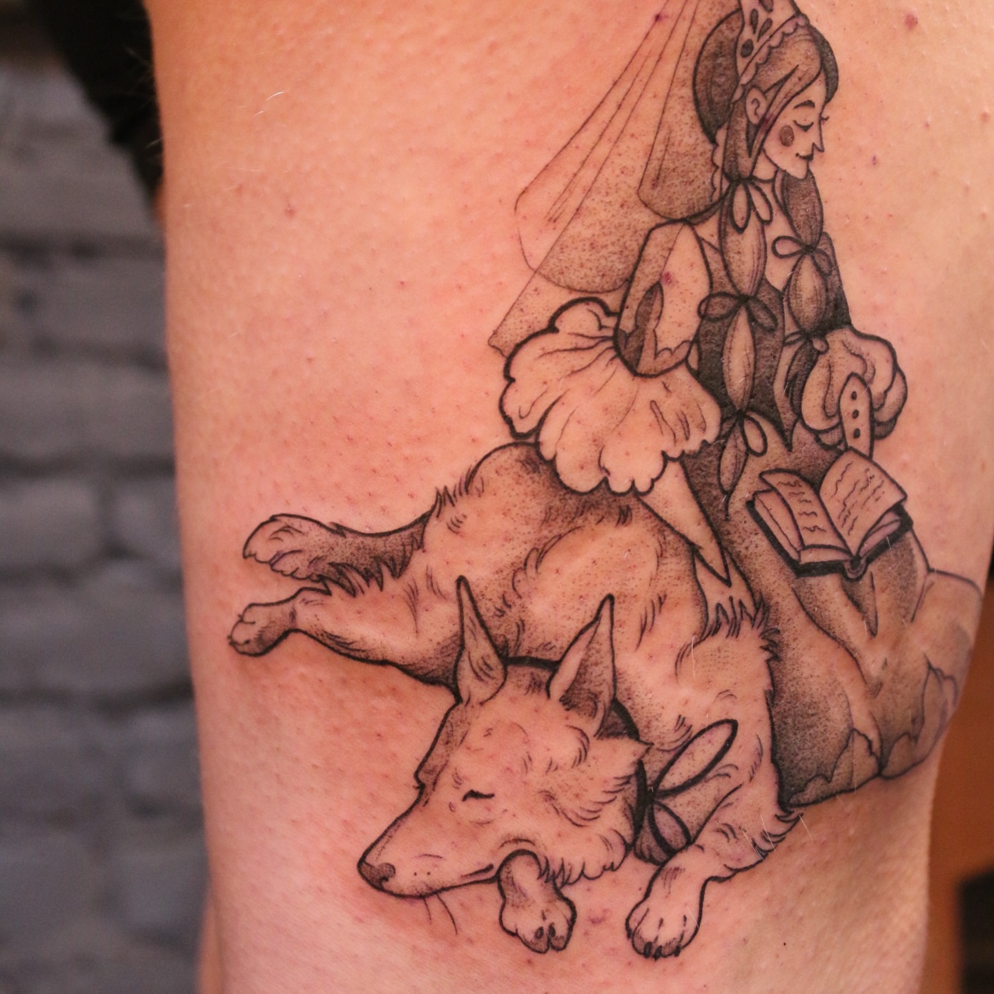 Girl reading with dog realism tattoo on the thigh by Summer Balcom M.