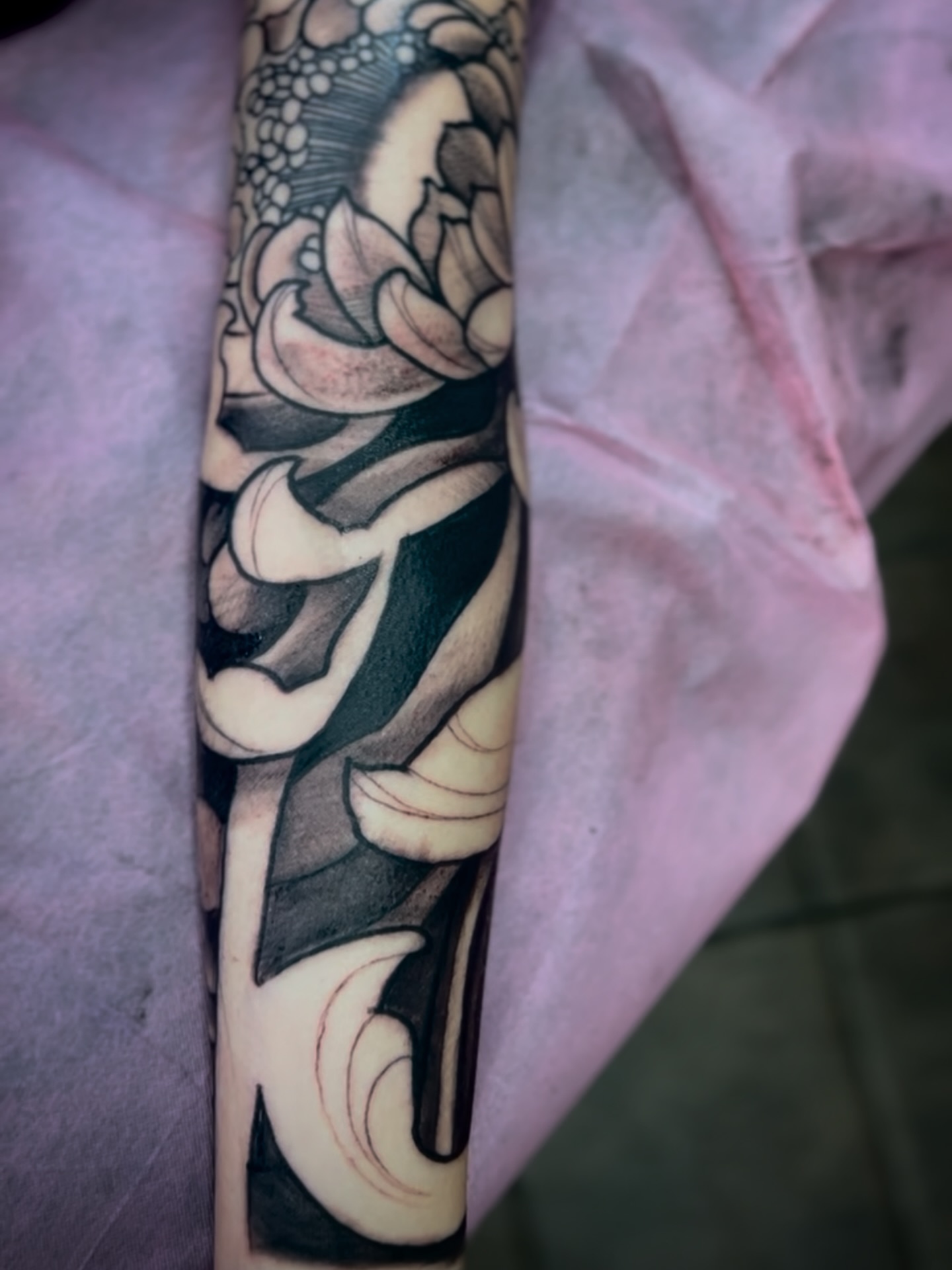 Lotus flower black and grey tattoo on the forearm by Ryan Willard, Denver, Colorado
