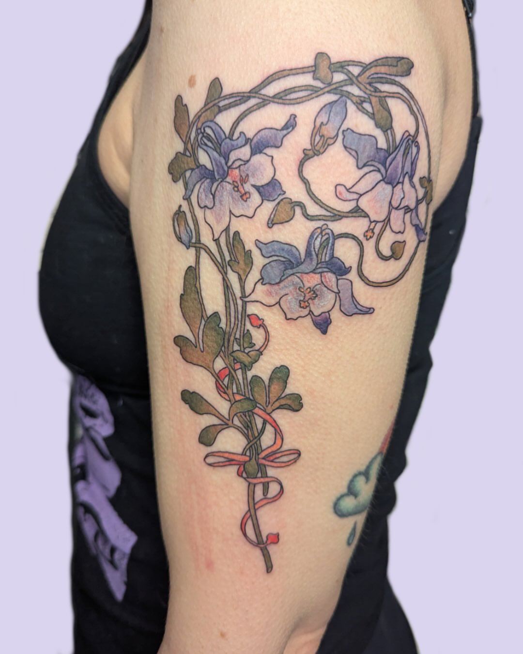 Flowers and vines watercolor tattoo on the forearm by Lepus