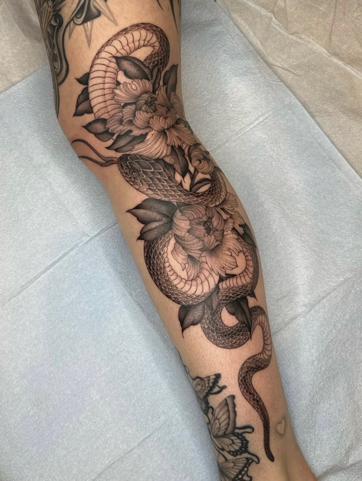 Snake and peony American traditional tattoo on the forearm by Адріянна Стабс 🇺🇦, New York, New York