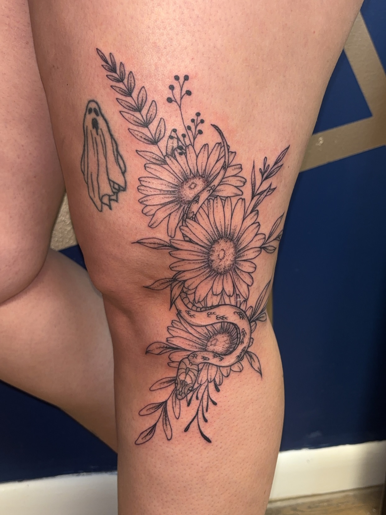 Flowers and ghost black and grey tattoo on the thigh by ✨Cyerra Lynne✨