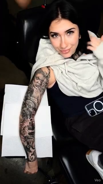 Realism tattoo on the upper arm by Drew King