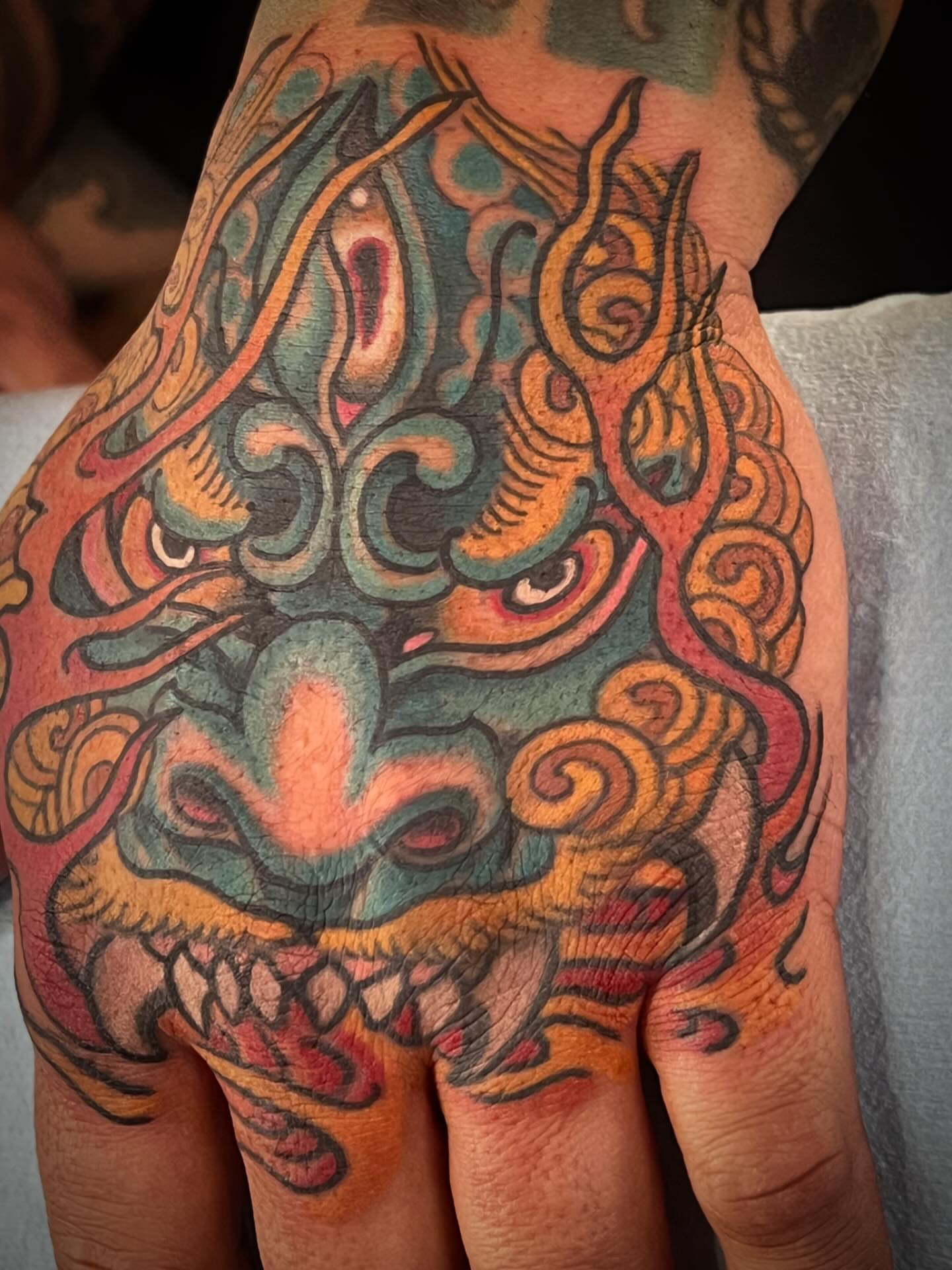 Lion japanese irezumi tattoo on the hand by Kayle Leogrande