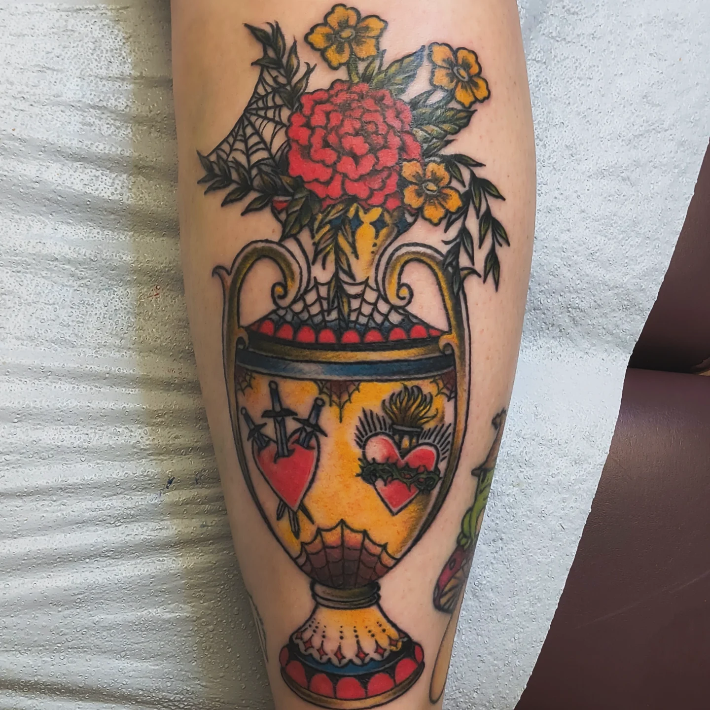 Vase with flowers American traditional tattoo on the forearm by Luna Faye