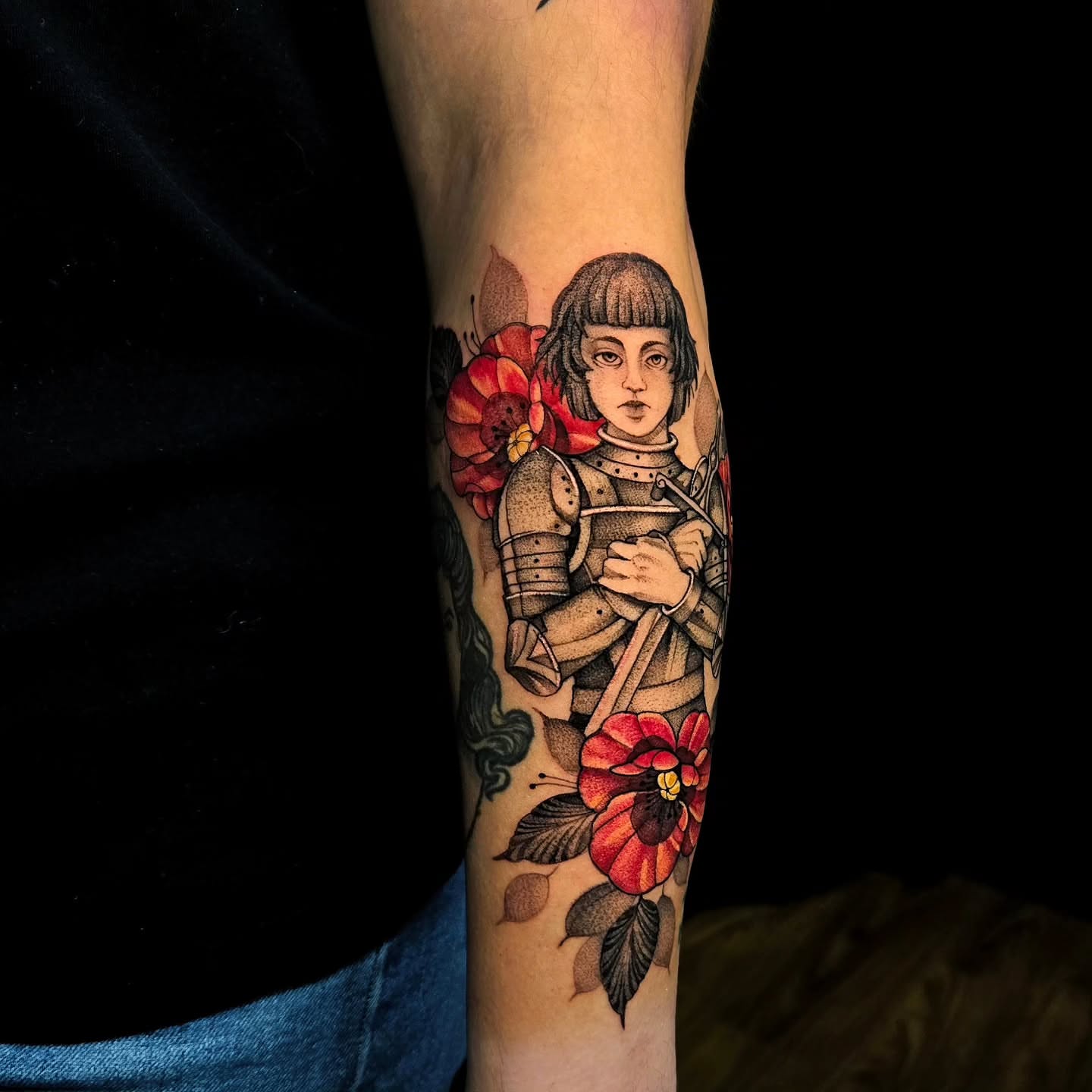 Female knight with flowers American traditional tattoo on the forearm by Jesseca Chinchilla