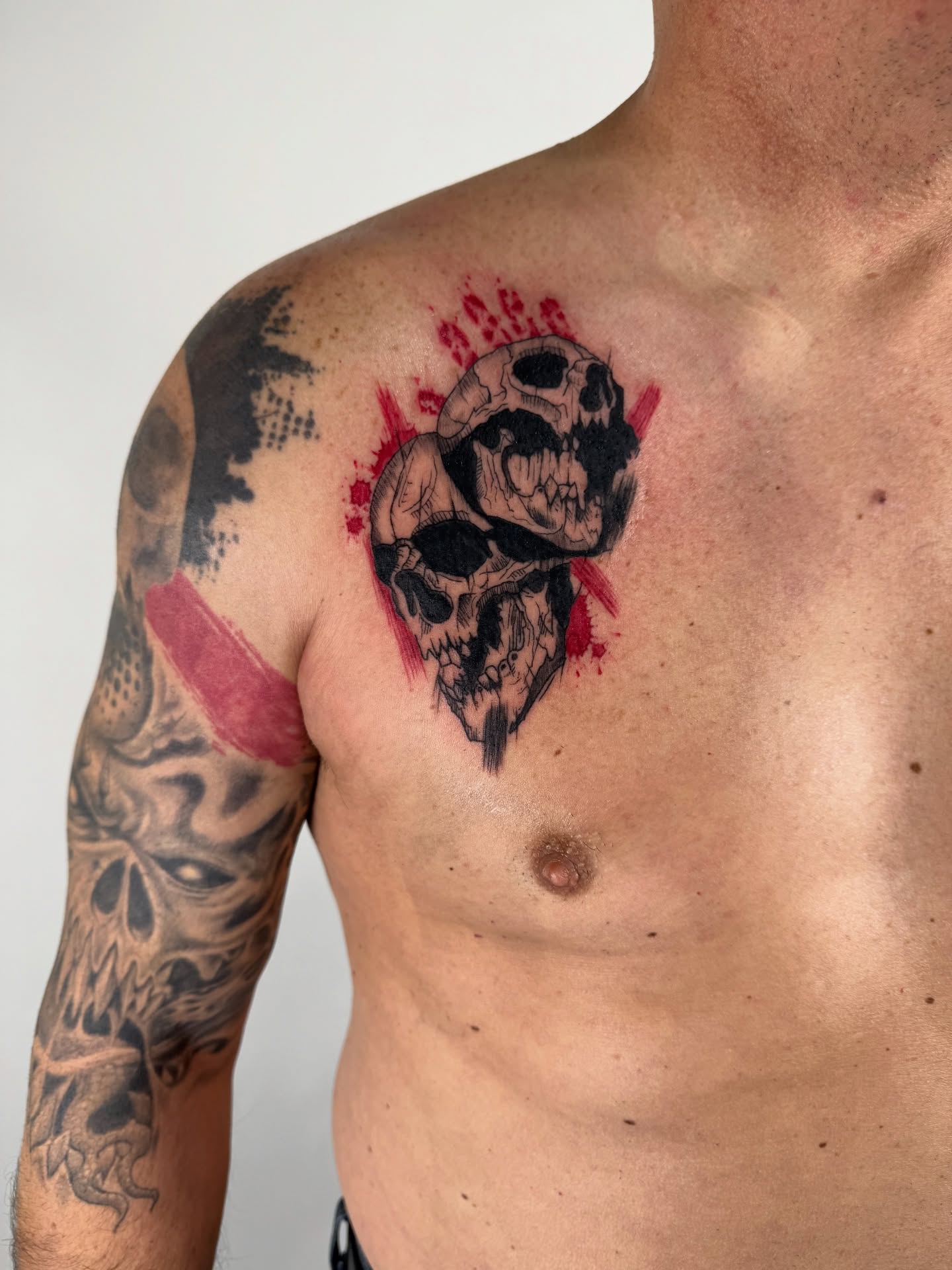 Skulls dotwork tattoo on the chest by sabina