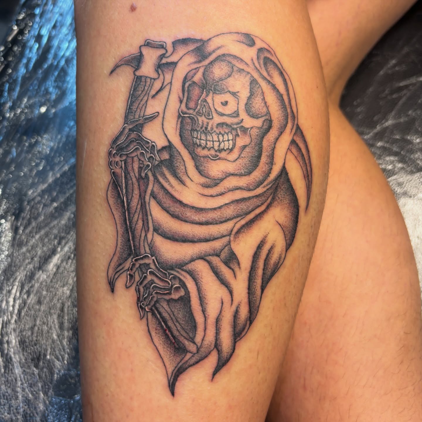 Grim reaper black and grey tattoo on the thigh by Miklo Montoya