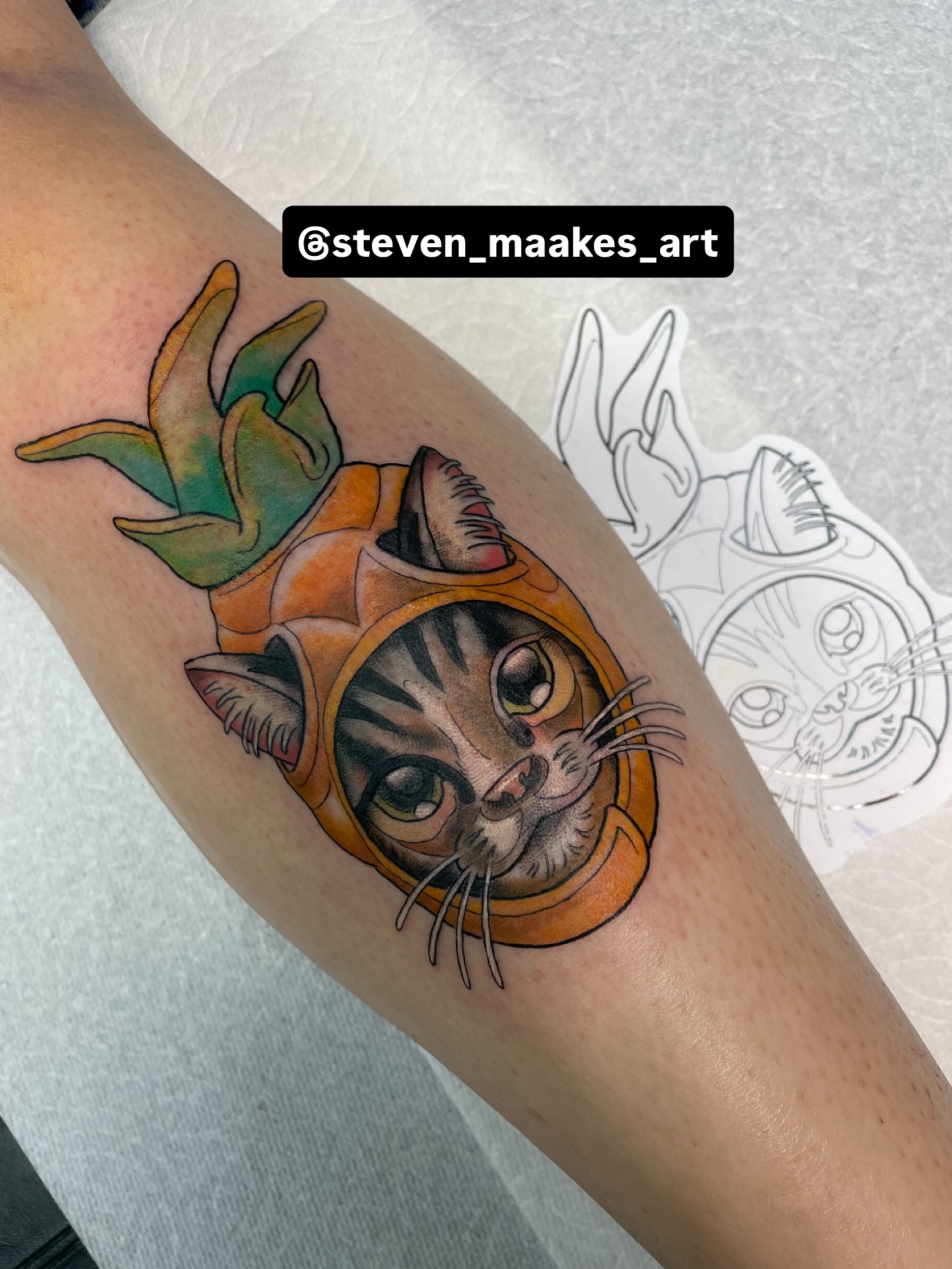 Cat in space helmet realism tattoo on the forearm by Steven Hodges