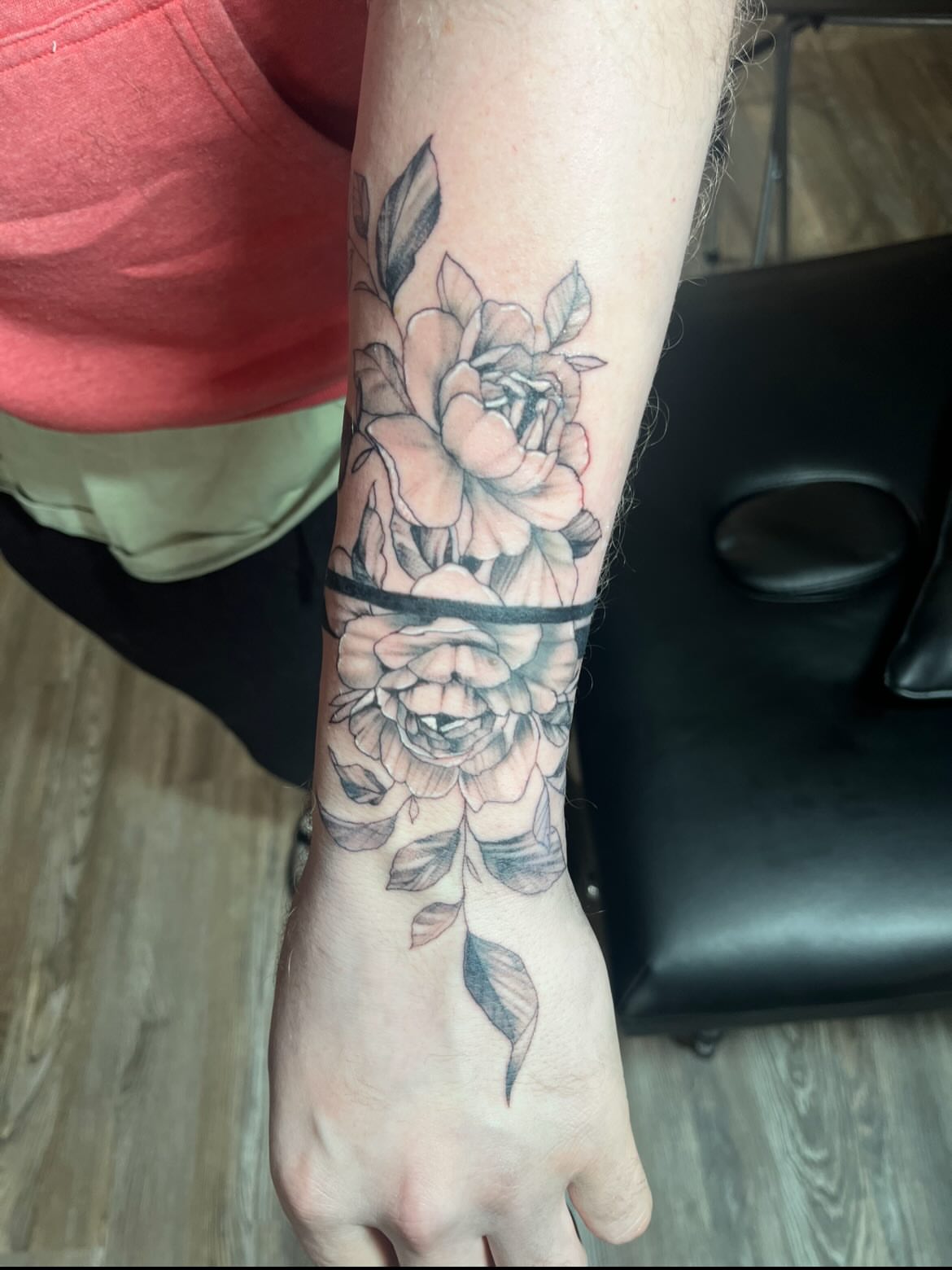 Floral bouquet black and grey tattoo on the forearm by Deville Pinson