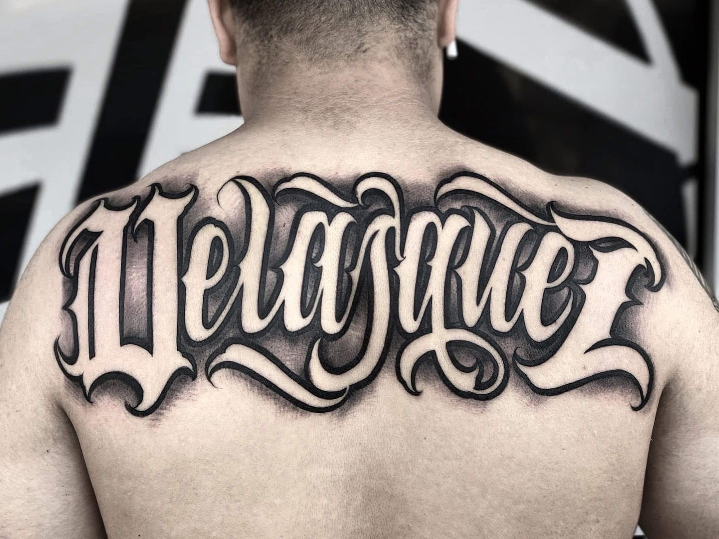 Script lettering lettering script tattoo on the back by Lex Miranda