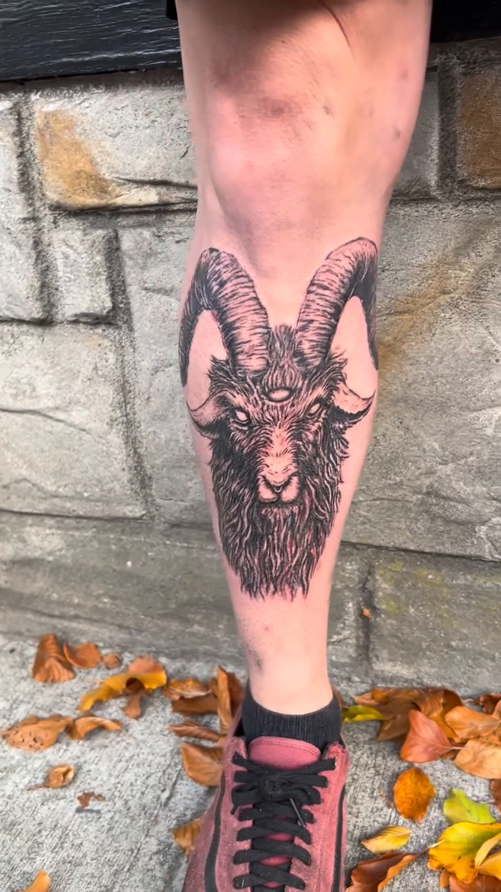 Ram's head with three eyes dark art tattoo on the forearm by Tim Andrews