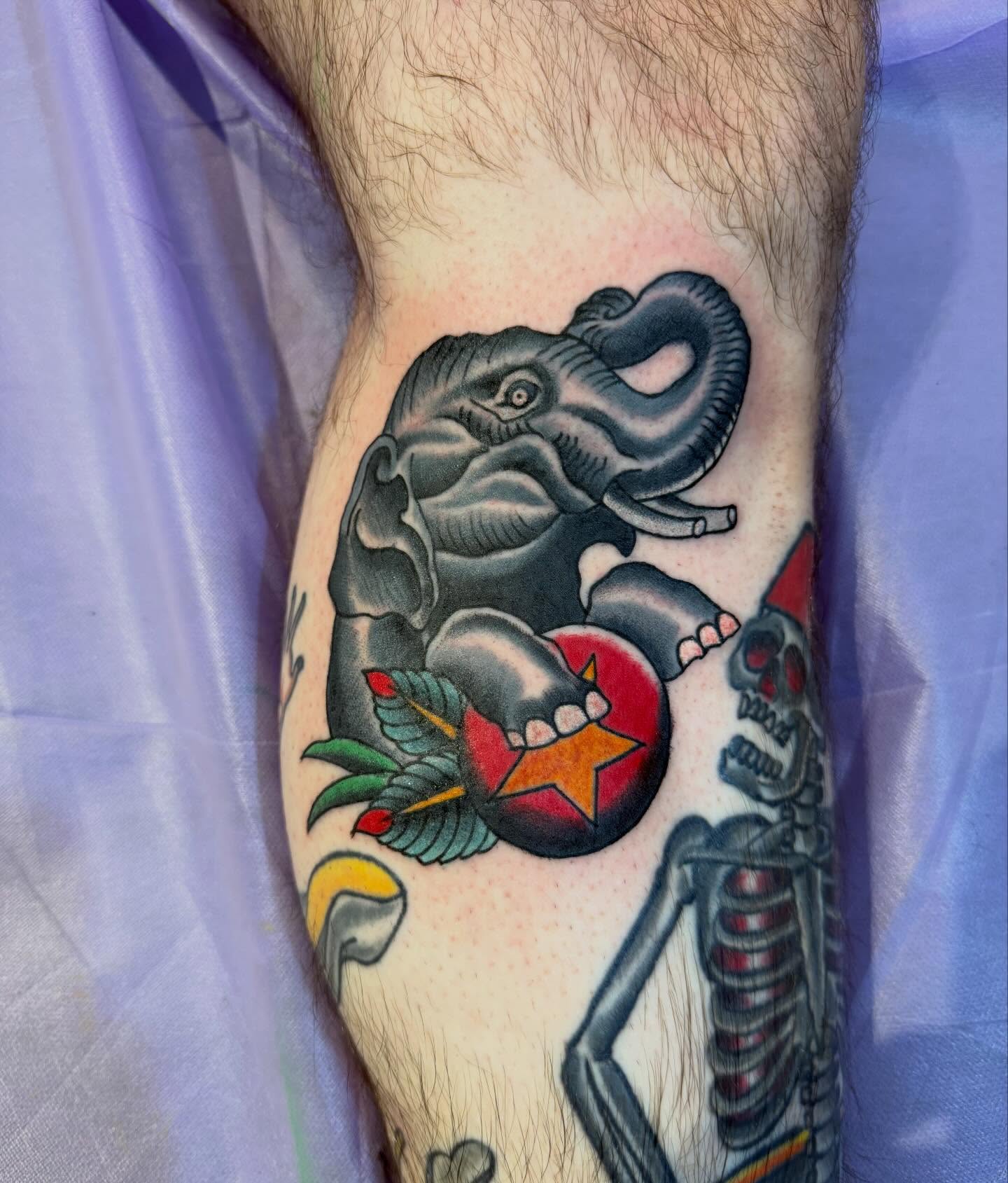 Elephant and skeleton American traditional tattoo on the forearm by Mike Kepper