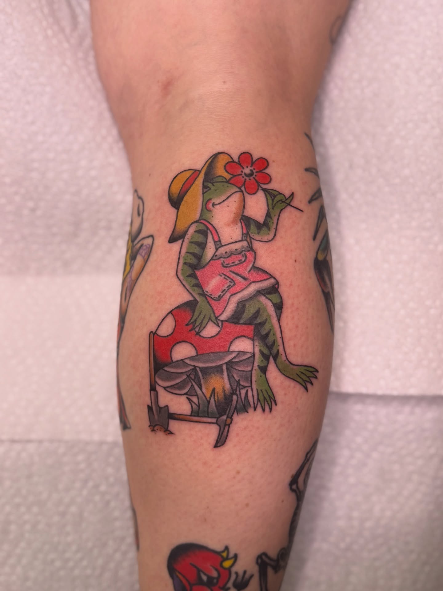 Frog with flower American traditional tattoo on the forearm by Ethan, Toledo, Ohio