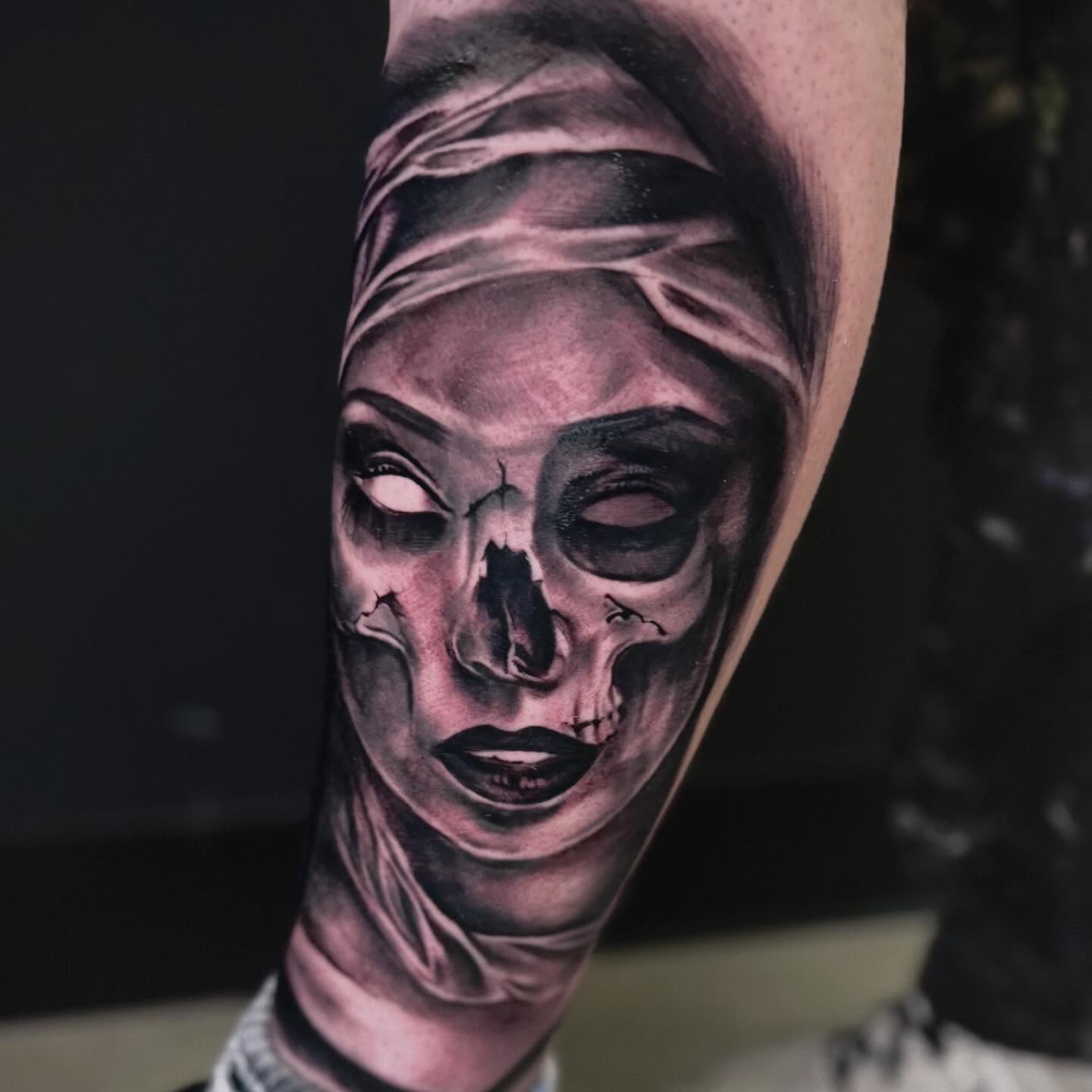 Woman's face realism tattoo on the forearm by Shawn Cook