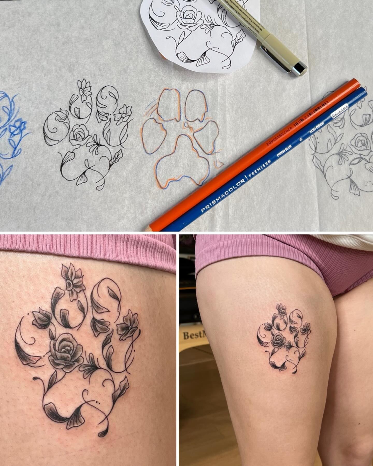 Paw print with floral details black and grey tattoo on the thigh by Jessica Kloos
