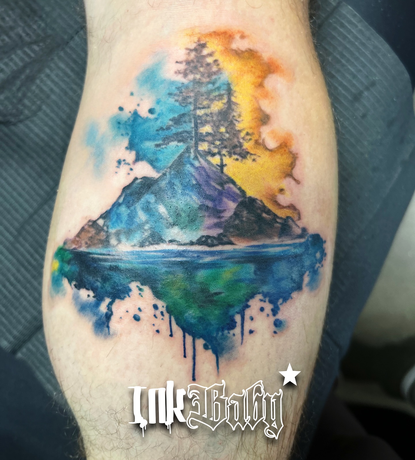Watercolor landscape watercolor tattoo on the forearm by Ayanna Luna