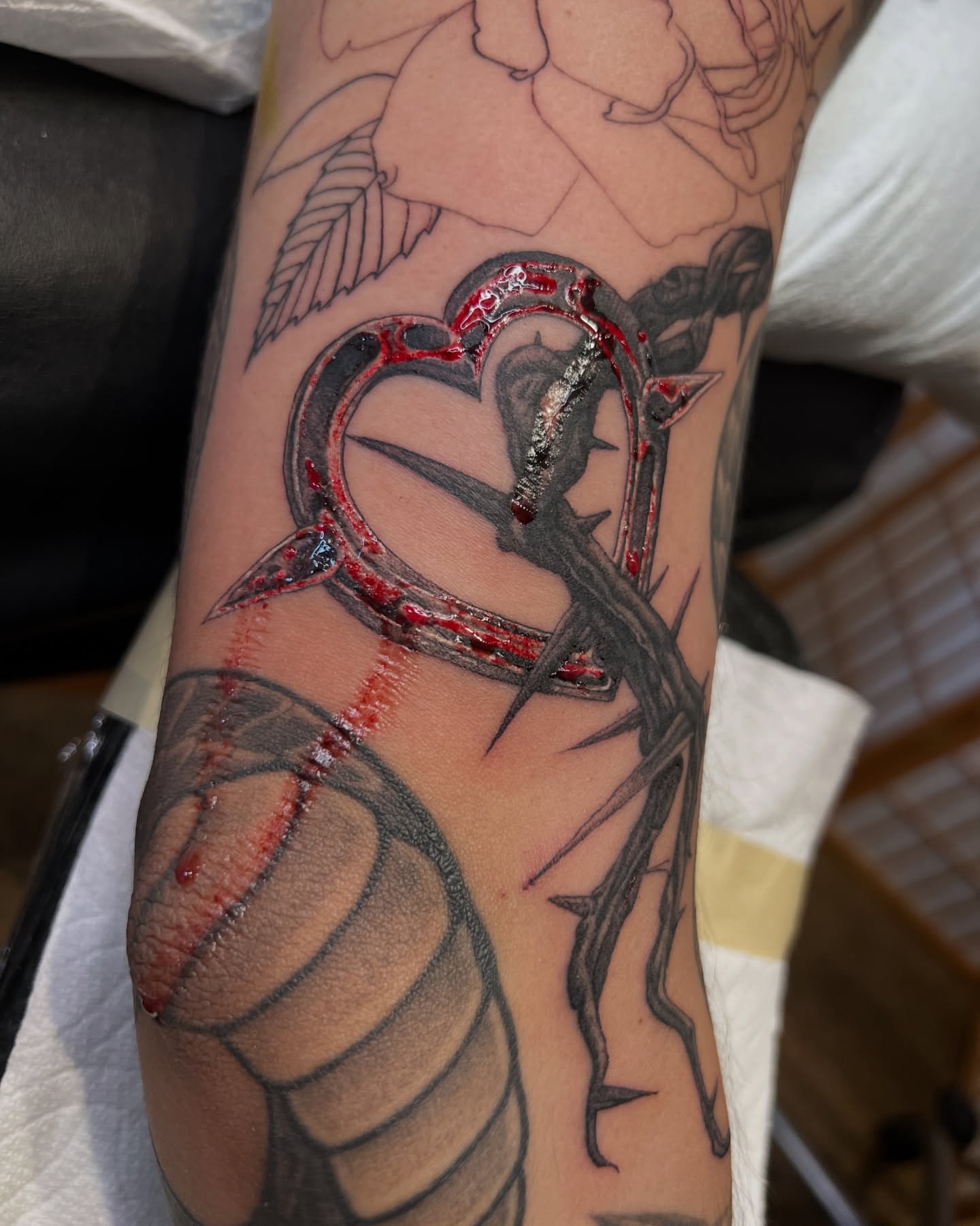 Heart with thorns realism tattoo on the forearm by James Fernella, San Francisco, California