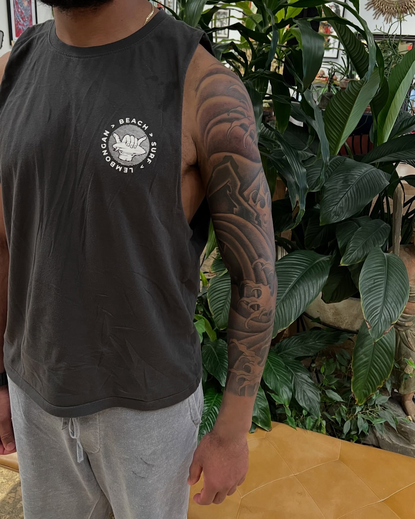 Wave black and grey tattoo on the upper arm by James Fernella, San Francisco, California