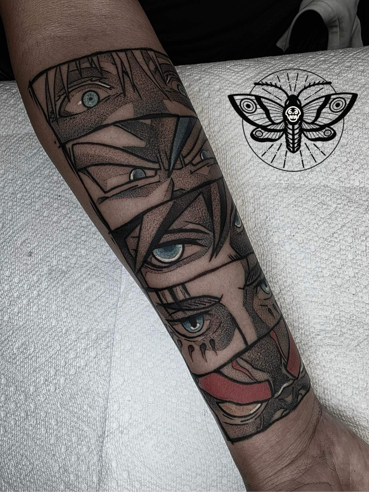 Eyes and face dotwork tattoo on the forearm by Danny, San Luis Obispo, California